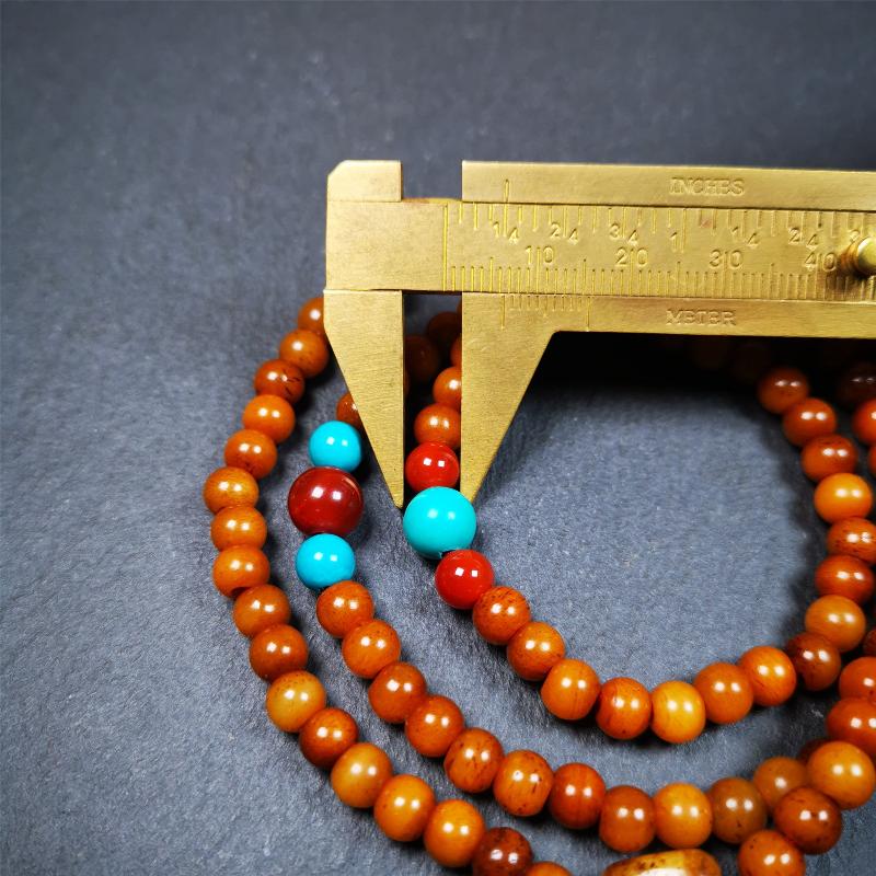 This yak bone mala was handmade from tibetan crafts man in Baiyu County,about 30 years old. It's composed of 108 pcs small size 6mm bone beads,with agate and turquoise beads,bone guru bead.Circumference about 61cm,24 inches.