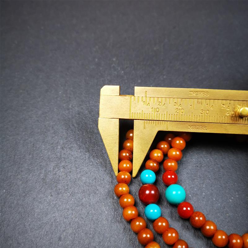 This yak bone mala was handmade from tibetan crafts man in Baiyu County,about 30 years old. It's composed of 108 pcs small size 6mm bone beads,with agate and turquoise beads,bone guru bead.Circumference about 61cm,24 inches.