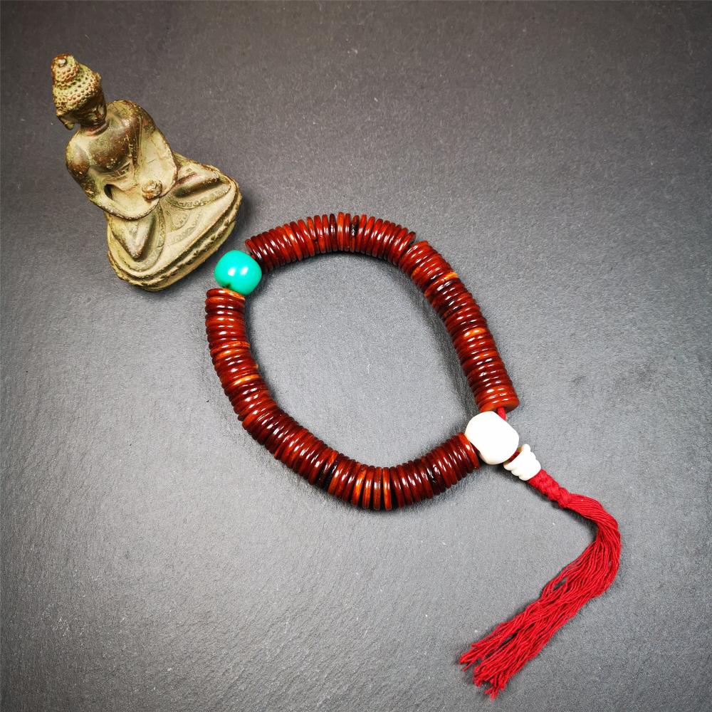 This bone carved mala beads is made by Tibetan craftsmen and come from Hepo Town, Baiyu County,about 30 years Old. It has 108 flat shape beads,1 turquoise spacer bead,and 1 shell guru bead,all hand carved.
