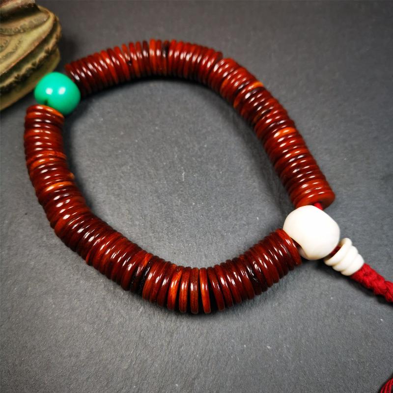 This bone carved mala beads is made by Tibetan craftsmen and come from Hepo Town, Baiyu County,about 30 years Old. It has 108 flat shape beads,1 turquoise spacer bead,and 1 shell guru bead,all hand carved.