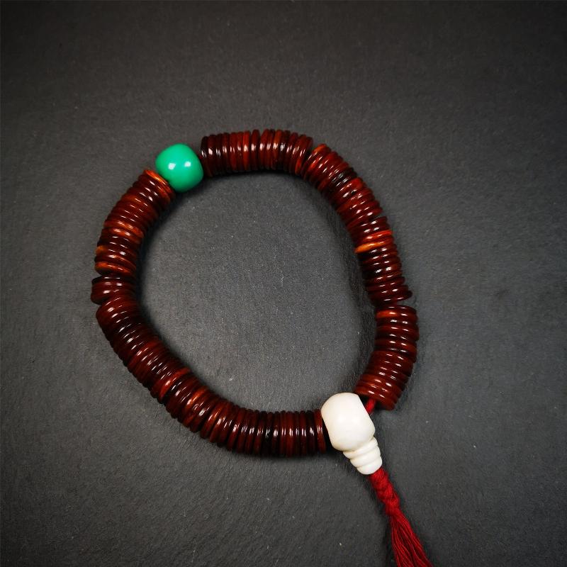 This bone carved mala beads is made by Tibetan craftsmen and come from Hepo Town, Baiyu County,about 30 years Old. It has 108 flat shape beads,1 turquoise spacer bead,and 1 shell guru bead,all hand carved.