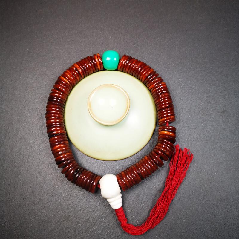 This bone carved mala beads is made by Tibetan craftsmen and come from Hepo Town, Baiyu County,about 30 years Old. It has 108 flat shape beads,1 turquoise spacer bead,and 1 shell guru bead,all hand carved.