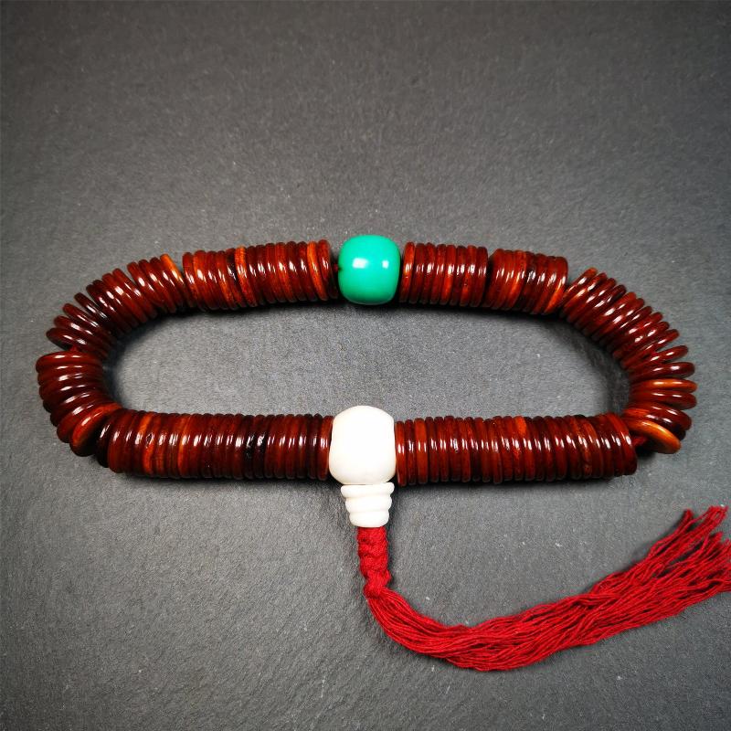 This bone carved mala beads is made by Tibetan craftsmen and come from Hepo Town, Baiyu County,about 30 years Old. It has 108 flat shape beads,1 turquoise spacer bead,and 1 shell guru bead,all hand carved.