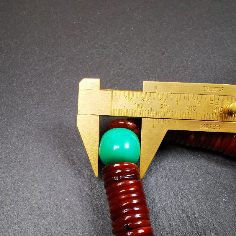 This bone carved mala beads is made by Tibetan craftsmen and come from Hepo Town, Baiyu County,about 30 years Old. It has 108 flat shape beads,1 turquoise spacer bead,and 1 shell guru bead,all hand carved.