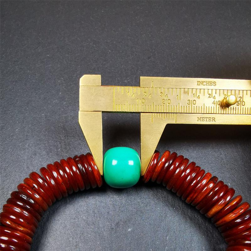 This bone carved mala beads is made by Tibetan craftsmen and come from Hepo Town, Baiyu County,about 30 years Old. It has 108 flat shape beads,1 turquoise spacer bead,and 1 shell guru bead,all hand carved.