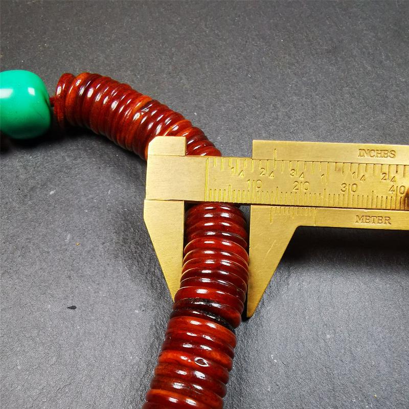 This bone carved mala beads is made by Tibetan craftsmen and come from Hepo Town, Baiyu County,about 30 years Old. It has 108 flat shape beads,1 turquoise spacer bead,and 1 shell guru bead,all hand carved.