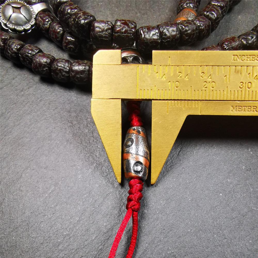 This old rudraksha mala was handmade from tibetan crafts man in Baiyu County. It's composed of 108 pcs 8mm rudraksha beads,with cold iron beads,1 pair of bead counters,guru bead,and dzi bead pendant.