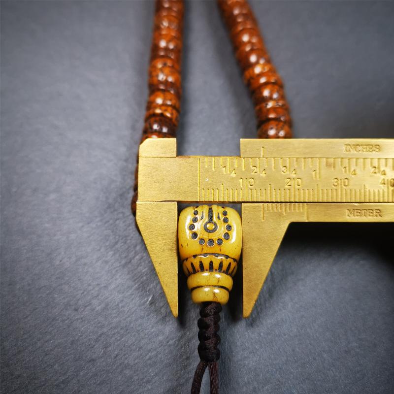 This lotus seed mala was collected from Baiyu county,about 40 years old,hold and blessed by a lama. It is composed of 108 bodhi seed beads, bevel cut shape,brown color,and 1 yak bone guru bead.