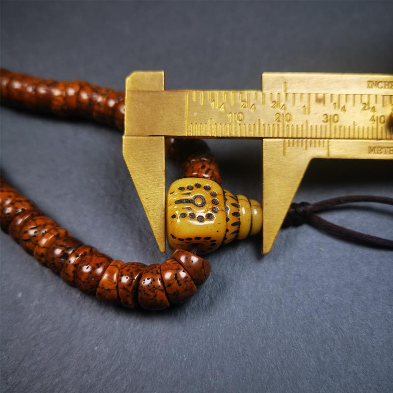 This lotus seed mala was collected from Baiyu county,about 40 years old,hold and blessed by a lama. It is composed of 108 bodhi seed beads, bevel cut shape,brown color,and 1 yak bone guru bead.
