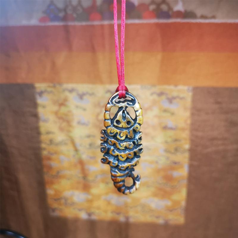 This unique bone carved Scorpion Guru pendant is made by Tibetan craftsmen in Hepo Township, Baiyu County, the birthplace of the famous Tibetan handicrafts. It's carved yak bone,brown color,2.2 inch height. You can make it into necklace,or mala pendant.