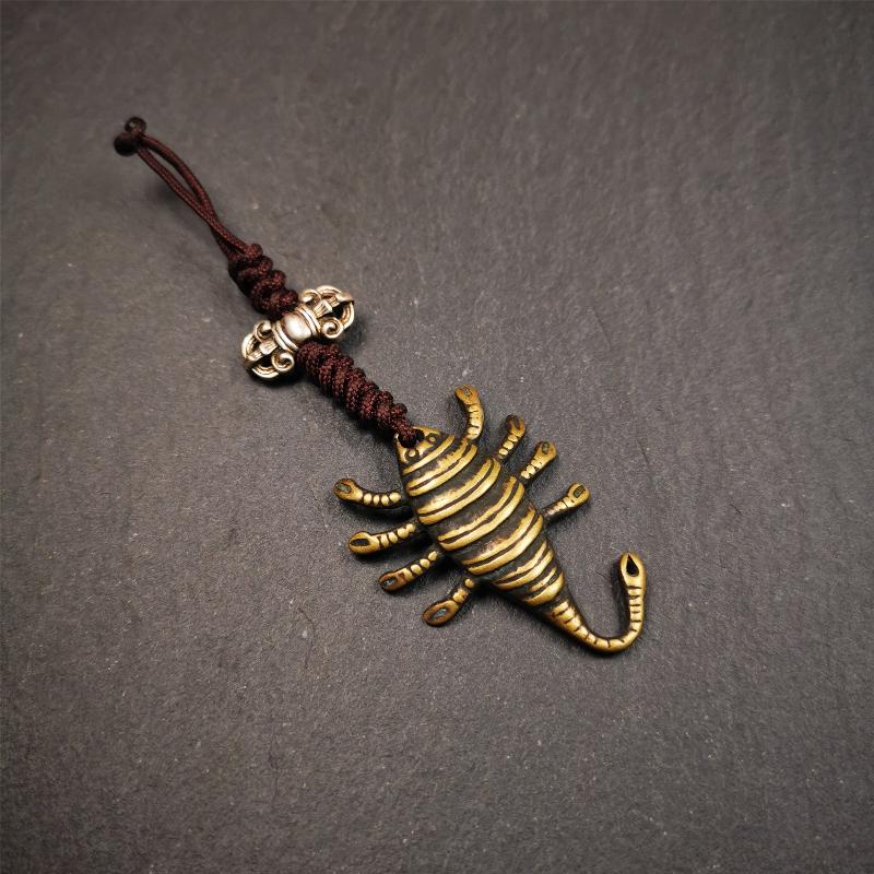 This scorpion amulet is collect from Baiyu Tibet,it is made of brass,yellow color,size is 1.57 inch. You can make it into a necklace pendant, bag hanging,keychain, or just put it on your desk,as an ornament.