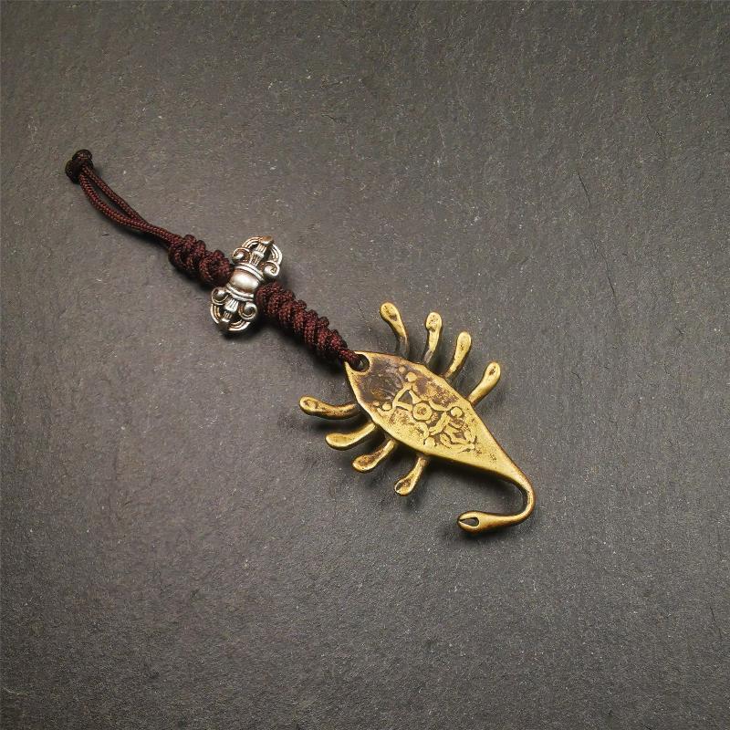 This scorpion amulet is collect from Baiyu Tibet,it is made of brass,yellow color,size is 1.57 inch. You can make it into a necklace pendant, bag hanging,keychain, or just put it on your desk,as an ornament.