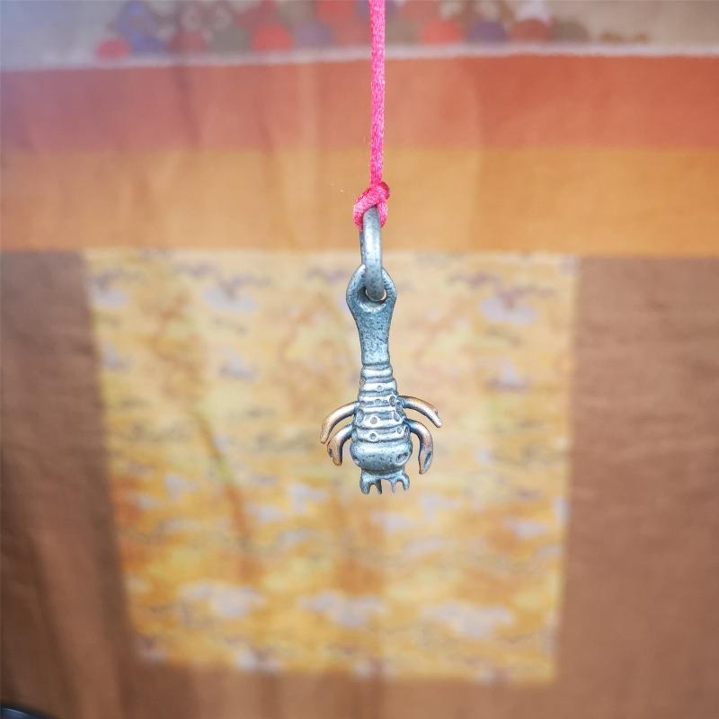 This is collect from Tibet, a old badge or pandent, made of thokcha (Cold Iron or meteoric iron), the shape is scorpion guru (from Guru Rinpoche), used the copper inlaid and carved craftsmanship. The legs of this scorpion are carved from copper and are inlaid in a body made of thunder iron,a beautiful pattern on the abdomen of the scorpion, exquisite and beautiful craftsmanship. You can make it into a necklace, or a keychain, or just put it on your desk,as an ornament.