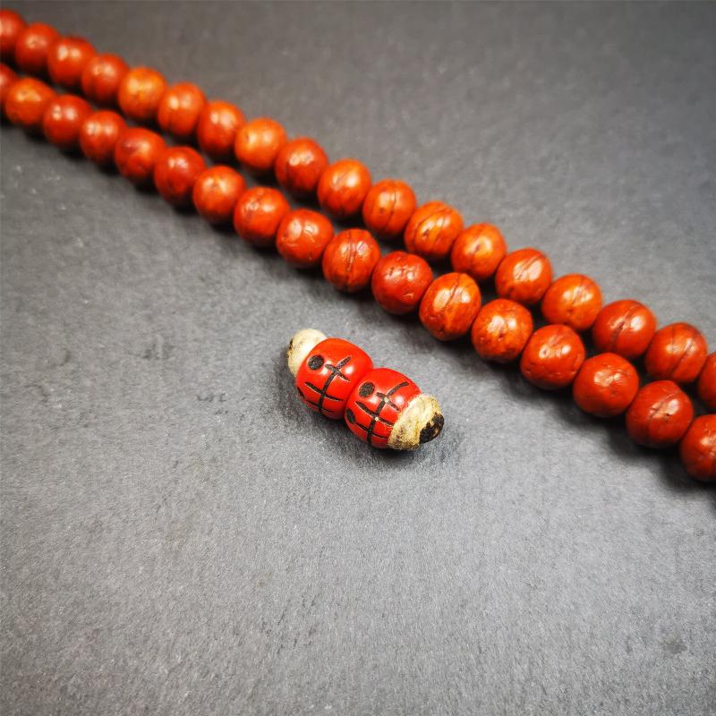 These marker beads were handmade by Tibetan craftsmen and come from Hepo Town, Baiyu County, the birthplace of the famous Tibetan handicrafts. It is made of plastic,carved skull pattern,red color,size is 0.4" × 0.3".