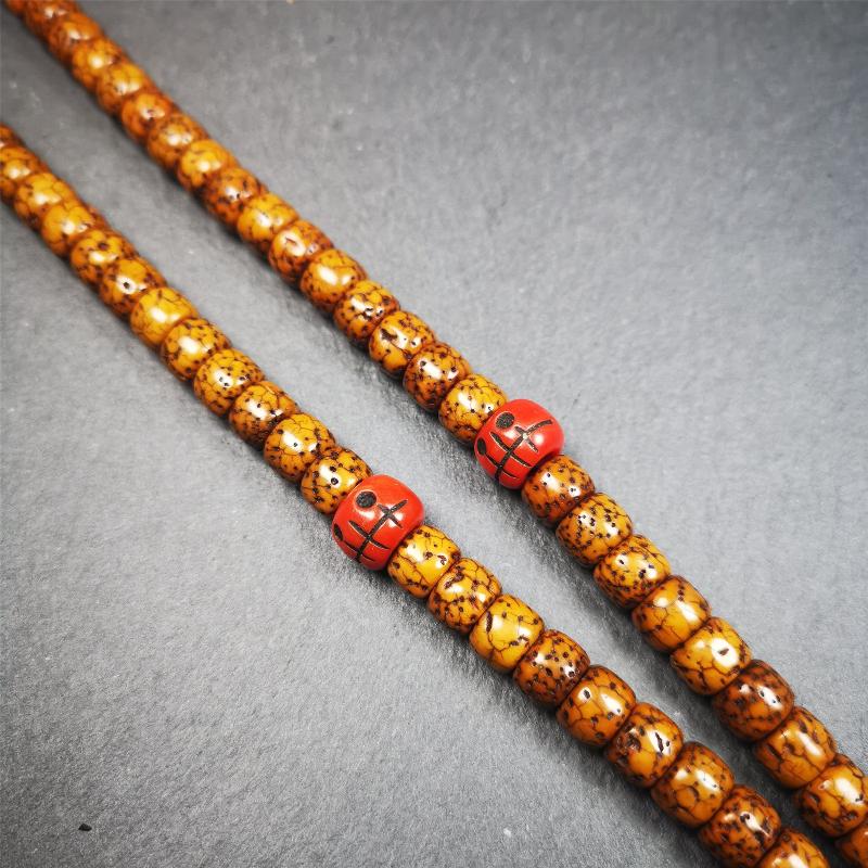 These marker beads were handmade by Tibetan craftsmen and come from Hepo Town, Baiyu County, the birthplace of the famous Tibetan handicrafts. It is made of plastic,carved skull pattern,red color,size is 0.4" × 0.3".