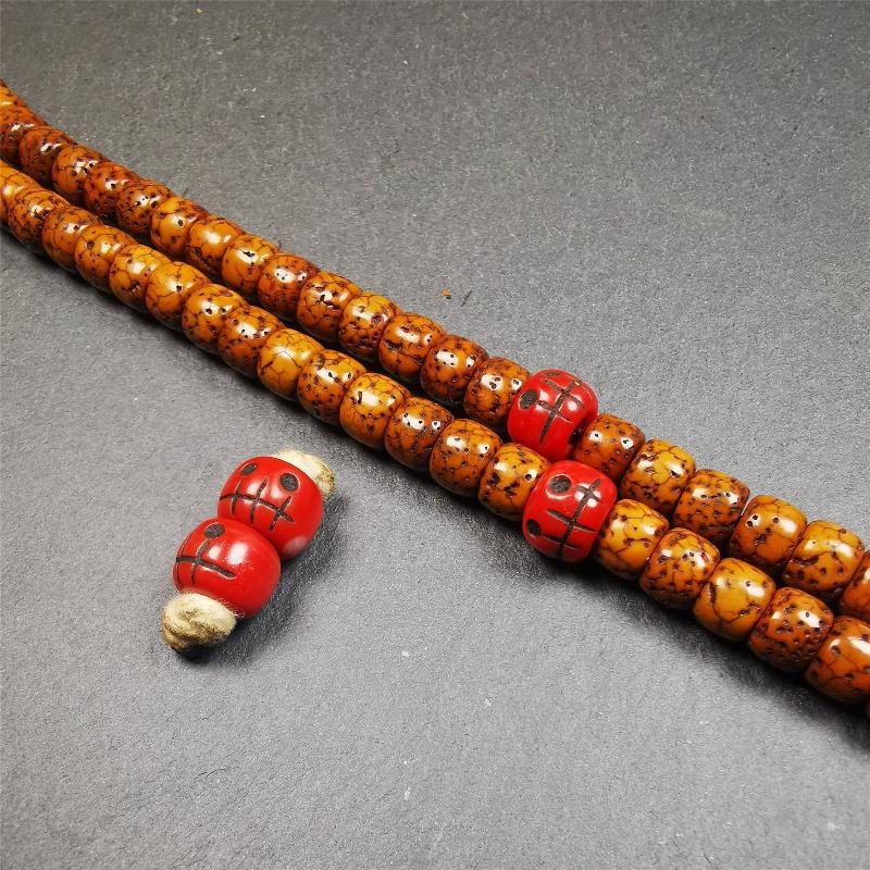 These marker beads were handmade by Tibetan craftsmen and come from Hepo Town, Baiyu County, the birthplace of the famous Tibetan handicrafts. It is made of plastic,carved skull pattern,red color,size is 0.4" × 0.3".