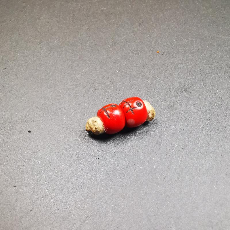 These marker beads were handmade by Tibetan craftsmen and come from Hepo Town, Baiyu County, the birthplace of the famous Tibetan handicrafts. It is made of plastic,carved skull pattern,red color,size is 0.4" × 0.3".