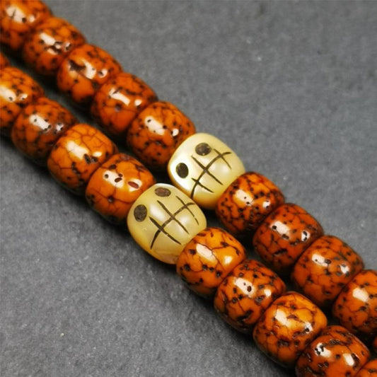 These marker beads were handmade by Tibetan craftsmen and come from Hepo Town, Baiyu County, the birthplace of the famous Tibetan handicrafts. It is made of fish bone,carved skull pattern,beige color,size is 0.3" × 0.3". Fit for 5-8mm mala (The reference in the photo is 7mm mala)