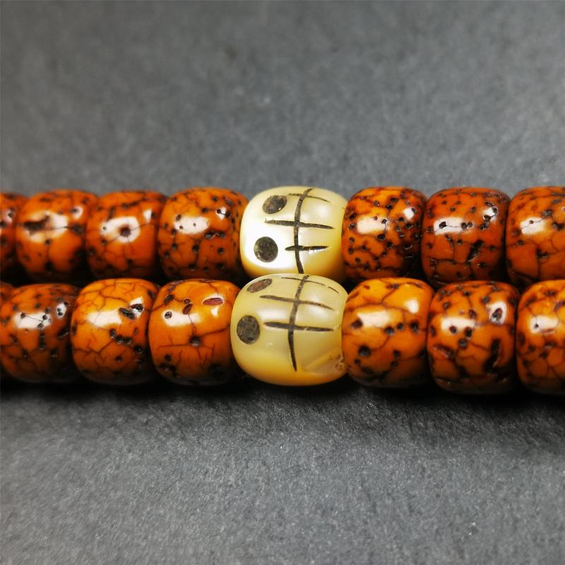 These marker beads were handmade by Tibetan craftsmen and come from Hepo Town, Baiyu County, the birthplace of the famous Tibetan handicrafts. It is made of fish bone,carved skull pattern,beige color,size is 0.3" × 0.3". Fit for 5-8mm mala (The reference in the photo is 7mm mala)