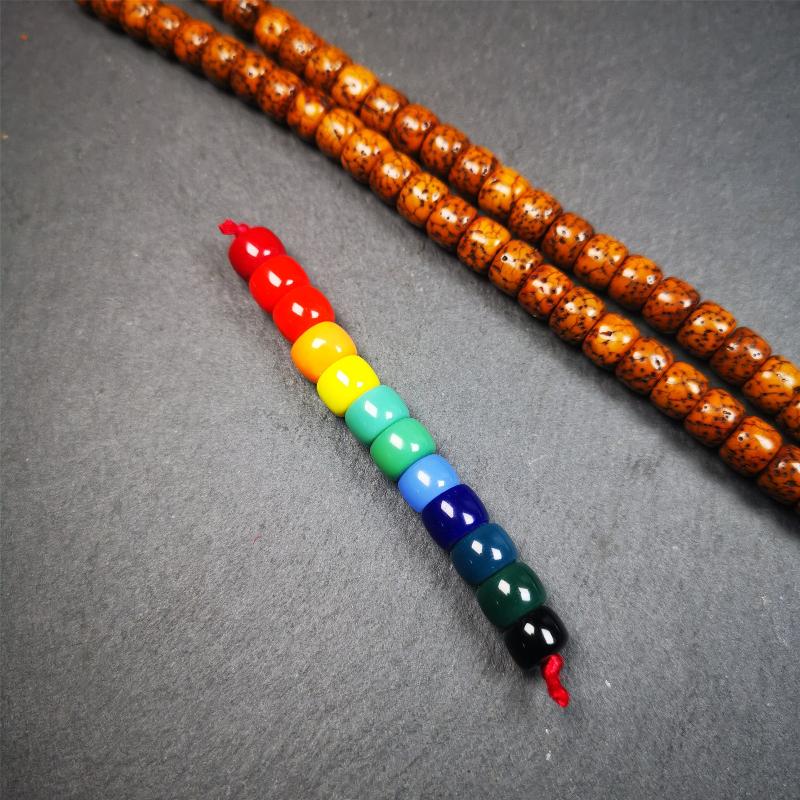 The price is 1 pair of 2 Strings Sherpa Glaze Beads,total 24 beads.(each string 12 beads) These marker beads were handmade by Tibetan craftsmen and come from Hepo Town, Baiyu County, the birthplace of the famous Tibetan handicrafts. It is made of sherpa glaze,rainbow color,size is 0.31" × 0.24". Fit for 6-8mm mala (The reference in the photo is 8mm lotus seed mala)