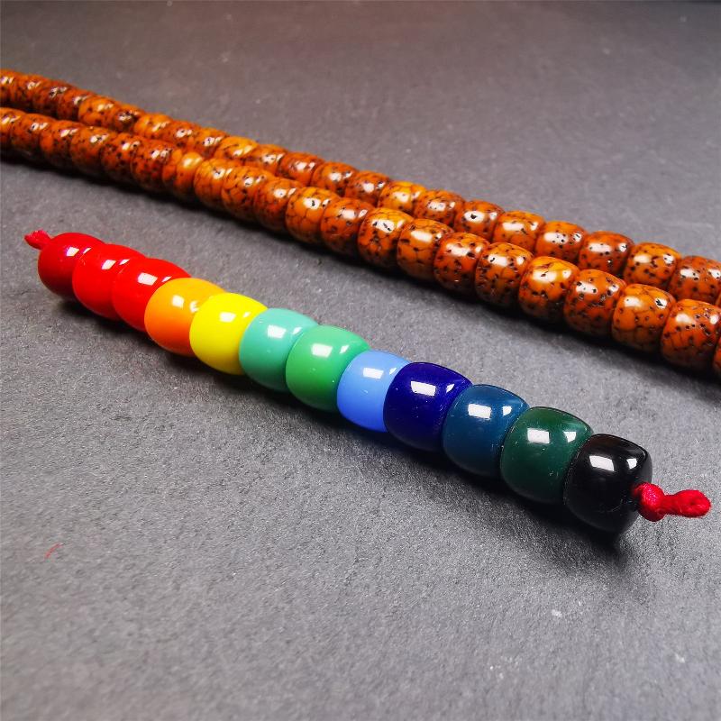 The price is 1 pair of 2 Strings Sherpa Glaze Beads,total 24 beads.(each string 12 beads) These marker beads were handmade by Tibetan craftsmen and come from Hepo Town, Baiyu County, the birthplace of the famous Tibetan handicrafts. It is made of sherpa glaze,rainbow color,size is 0.31" × 0.24". Fit for 6-8mm mala (The reference in the photo is 8mm lotus seed mala)