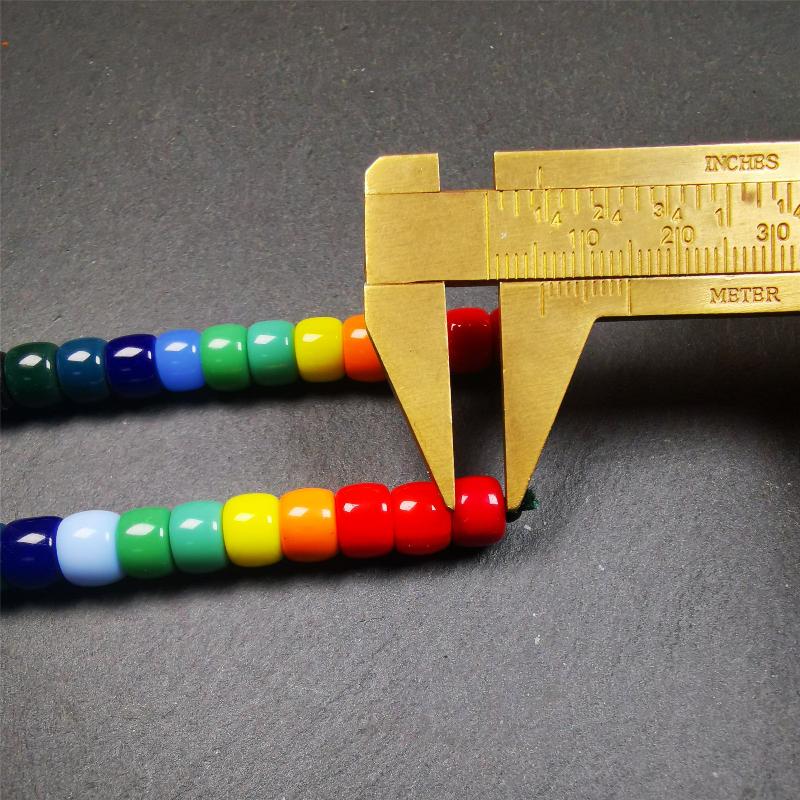 The price is 1 pair of 2 Strings Sherpa Glaze Beads,total 24 beads.(each string 12 beads) These marker beads were handmade by Tibetan craftsmen and come from Hepo Town, Baiyu County, the birthplace of the famous Tibetan handicrafts. It is made of sherpa glaze,rainbow color,size is 0.31" × 0.24". Fit for 6-8mm mala (The reference in the photo is 8mm lotus seed mala)