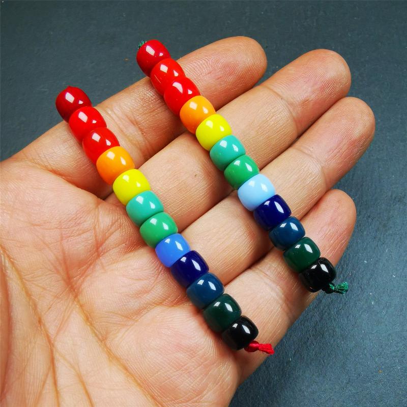The price is 1 pair of 2 Strings Sherpa Glaze Beads,total 24 beads.(each string 12 beads) These marker beads were handmade by Tibetan craftsmen and come from Hepo Town, Baiyu County, the birthplace of the famous Tibetan handicrafts. It is made of sherpa glaze,rainbow color,size is 0.31" × 0.24". Fit for 6-8mm mala (The reference in the photo is 8mm lotus seed mala)