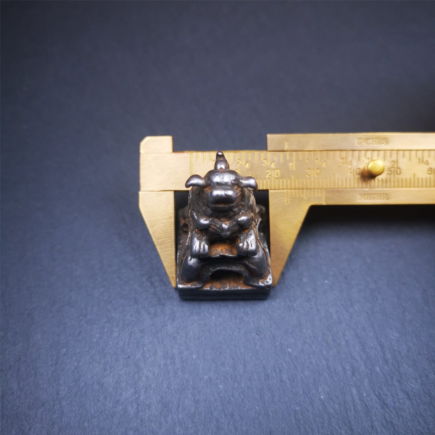 This antique seal was collected from Derge,Tibet,about 30 years old. It is made of cold iron,carved Snow Lion Shape, and Stupa symbol seal on the bottom,size is 1.38 inches.