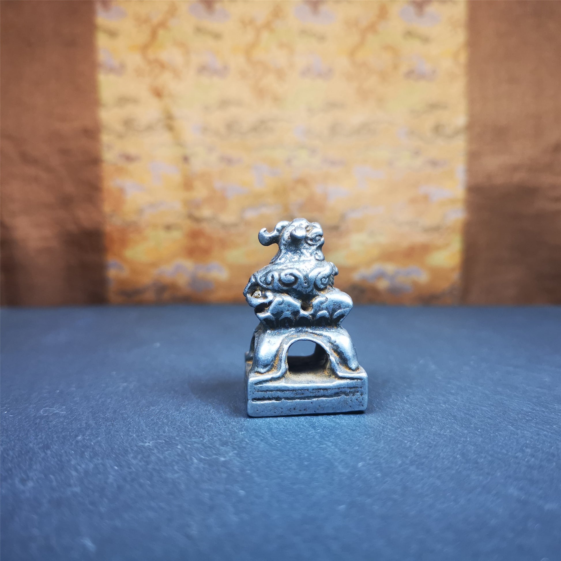 This antique seal was collected from Derge,Tibet,about 30 years old. It is made of cold iron,carved Snow Lion Shape, and  Stupa symbol seal on the bottom,size is 1.38 inches.