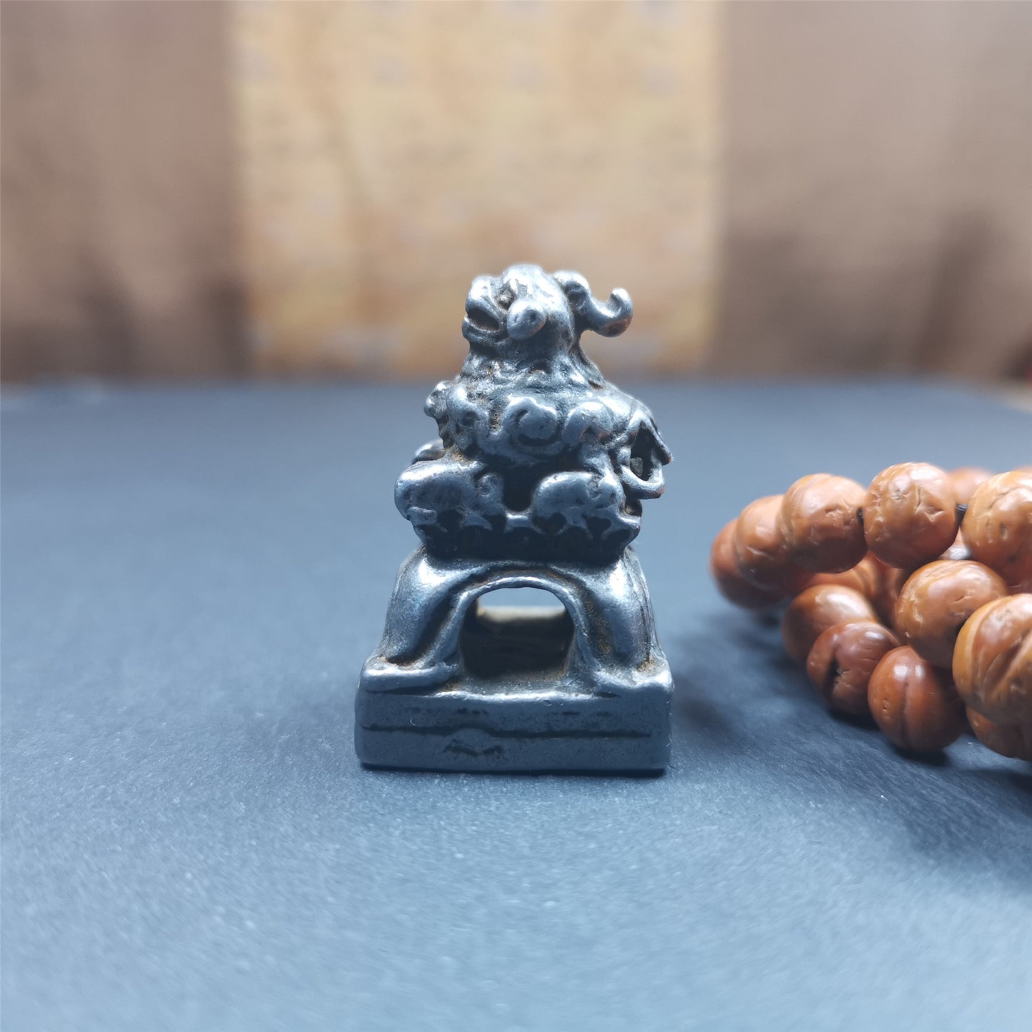 This antique seal was collected from Derge,Tibet,about 30 years old. It is made of cold iron,carved Snow Lion Shape, and Stupa symbol seal on the bottom,size is 1.38 inches.