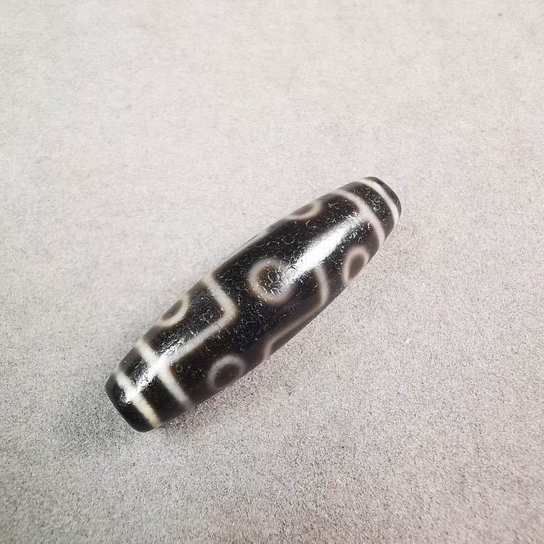 9 Eyed Dzi Bead - Gandhanra-ART
