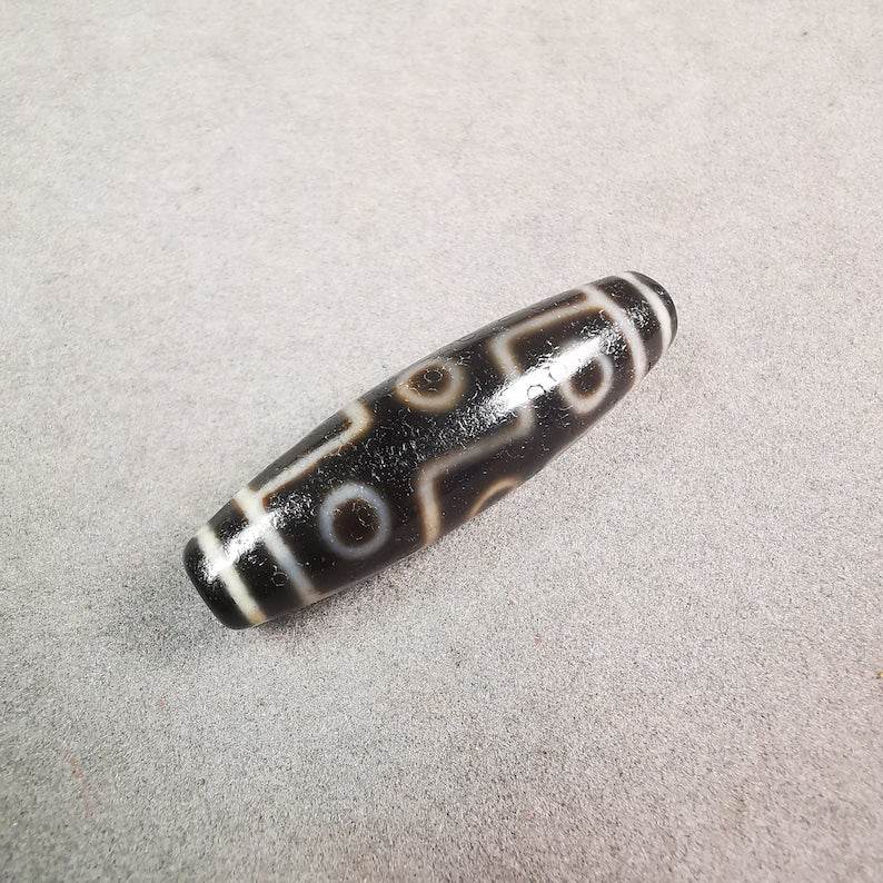 9 Eyed Dzi Bead - Gandhanra-ART