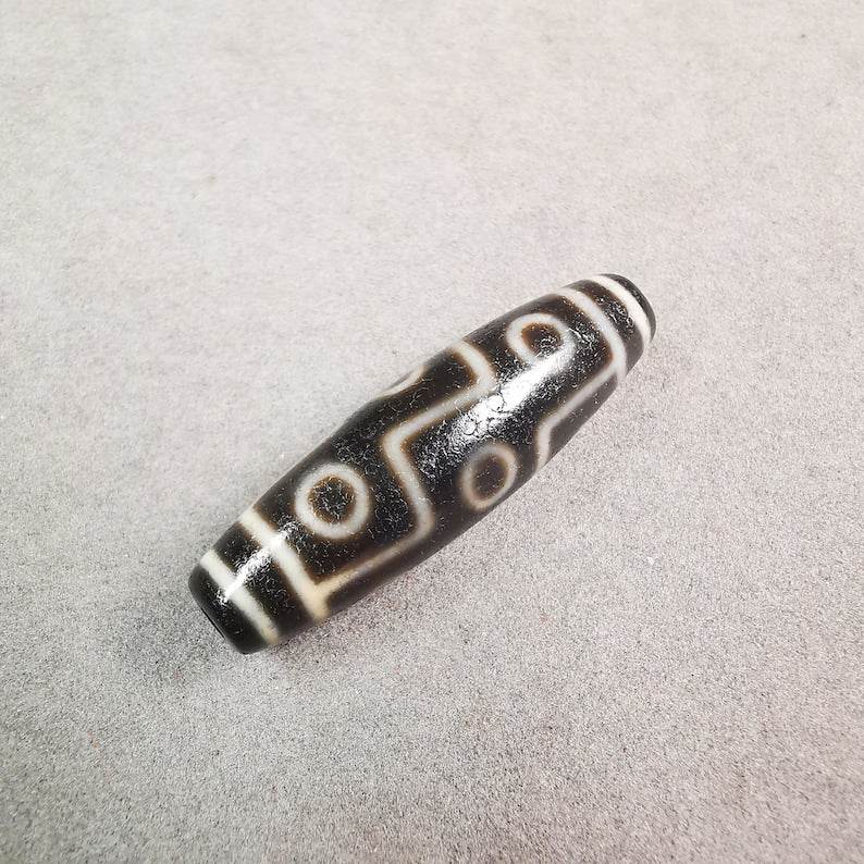 9 Eyed Dzi Bead - Gandhanra-ART