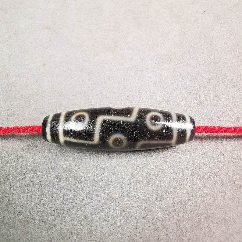 9 Eyed Dzi Bead - Gandhanra-ART