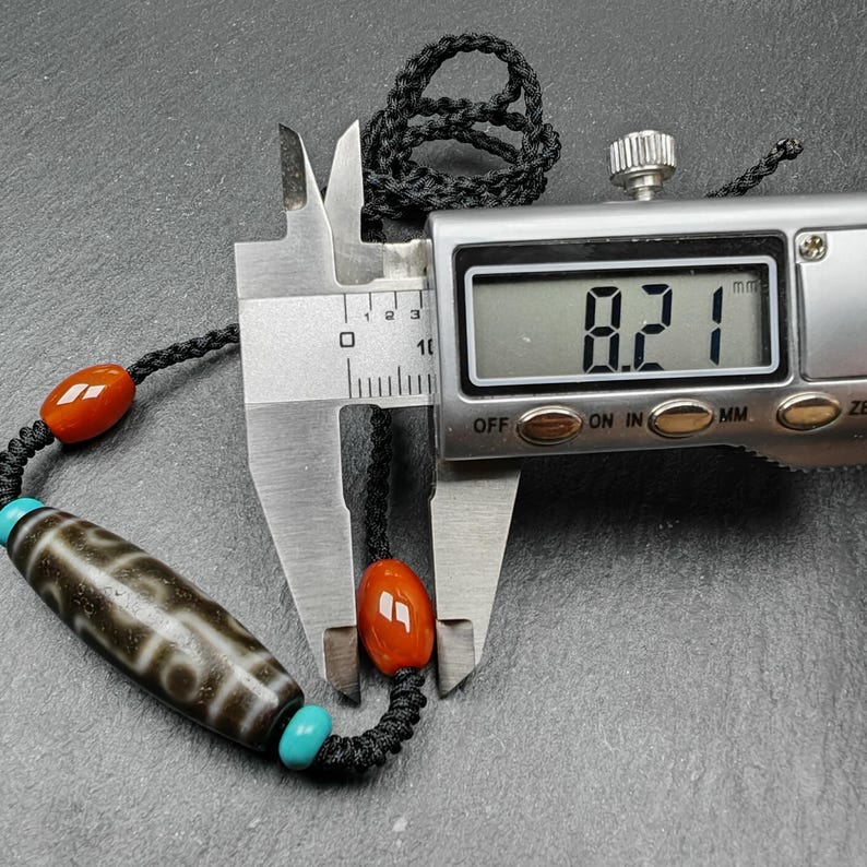 Tibetan 9 Eyes Dzi Bead Necklace | 1.5" x 0.4"