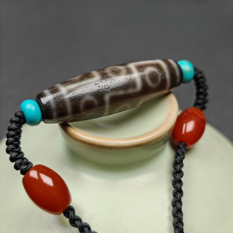 Tibetan 9 Eyes Dzi Bead Necklace | 1.5" x 0.4"