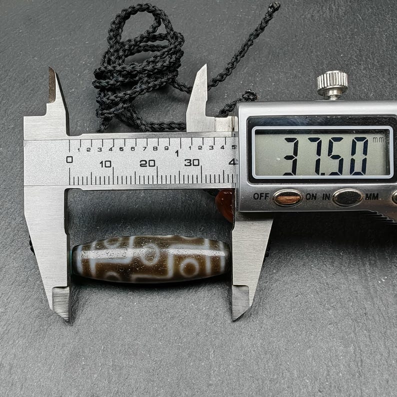 Tibetan 9 Eyes Dzi Bead Necklace | 1.5" x 0.4"