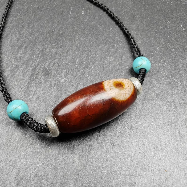Fire Agate Lotus Dzi Amulet 31 x 15mm