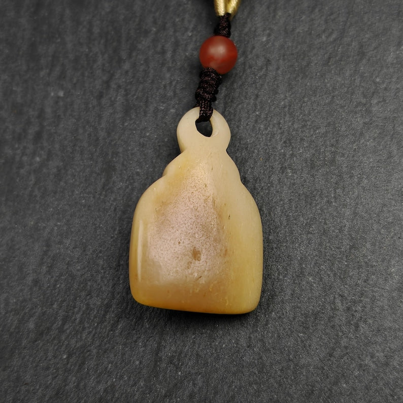 Buddhist Amulet | Copper Chenrezig Badge in Yak Bone Frame