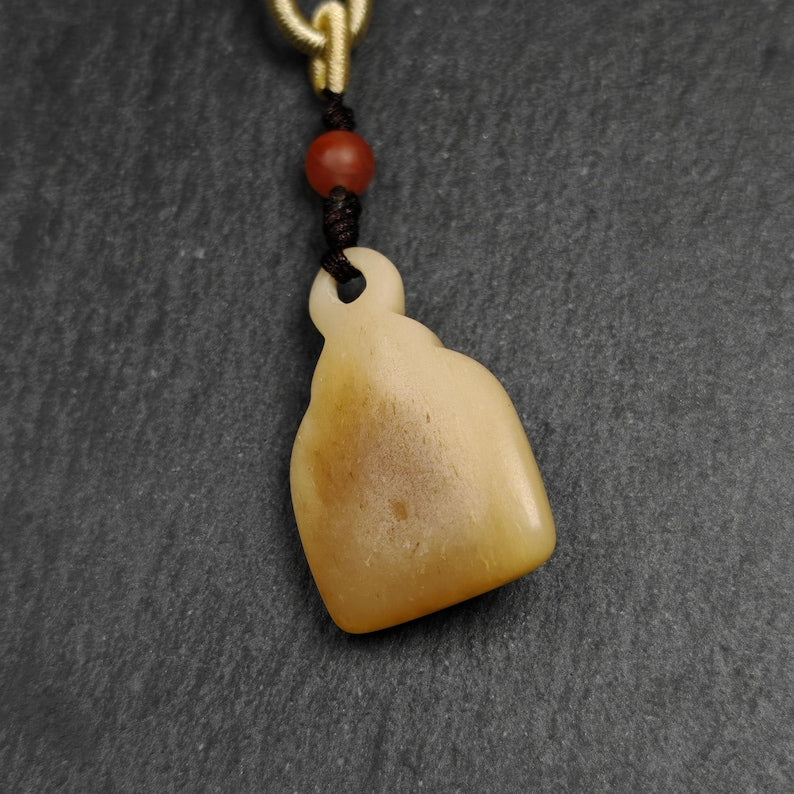 Buddhist Amulet | Copper Chenrezig Badge in Yak Bone Frame