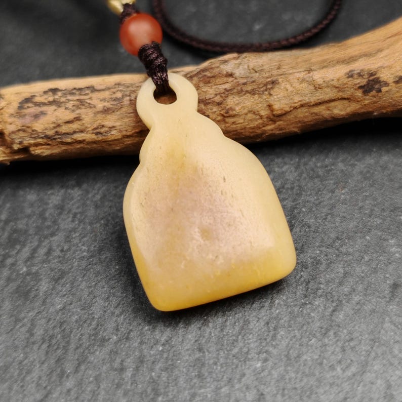 Buddhist Amulet | Copper Chenrezig Badge in Yak Bone Frame