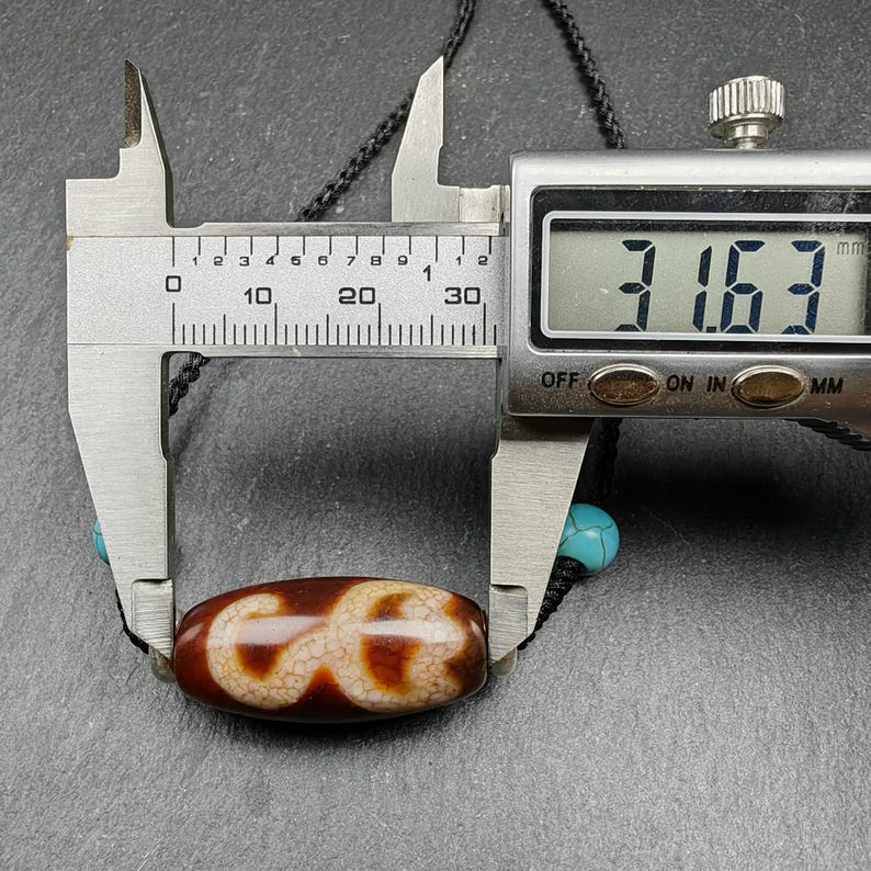 Fire Agate Lotus Dzi Amulet 31 x 15mm