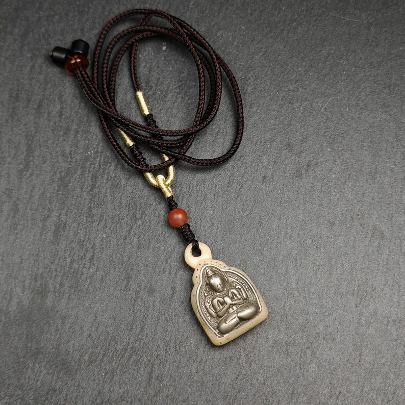 Buddhist Amulet | Copper Chenrezig Badge in Yak Bone Frame