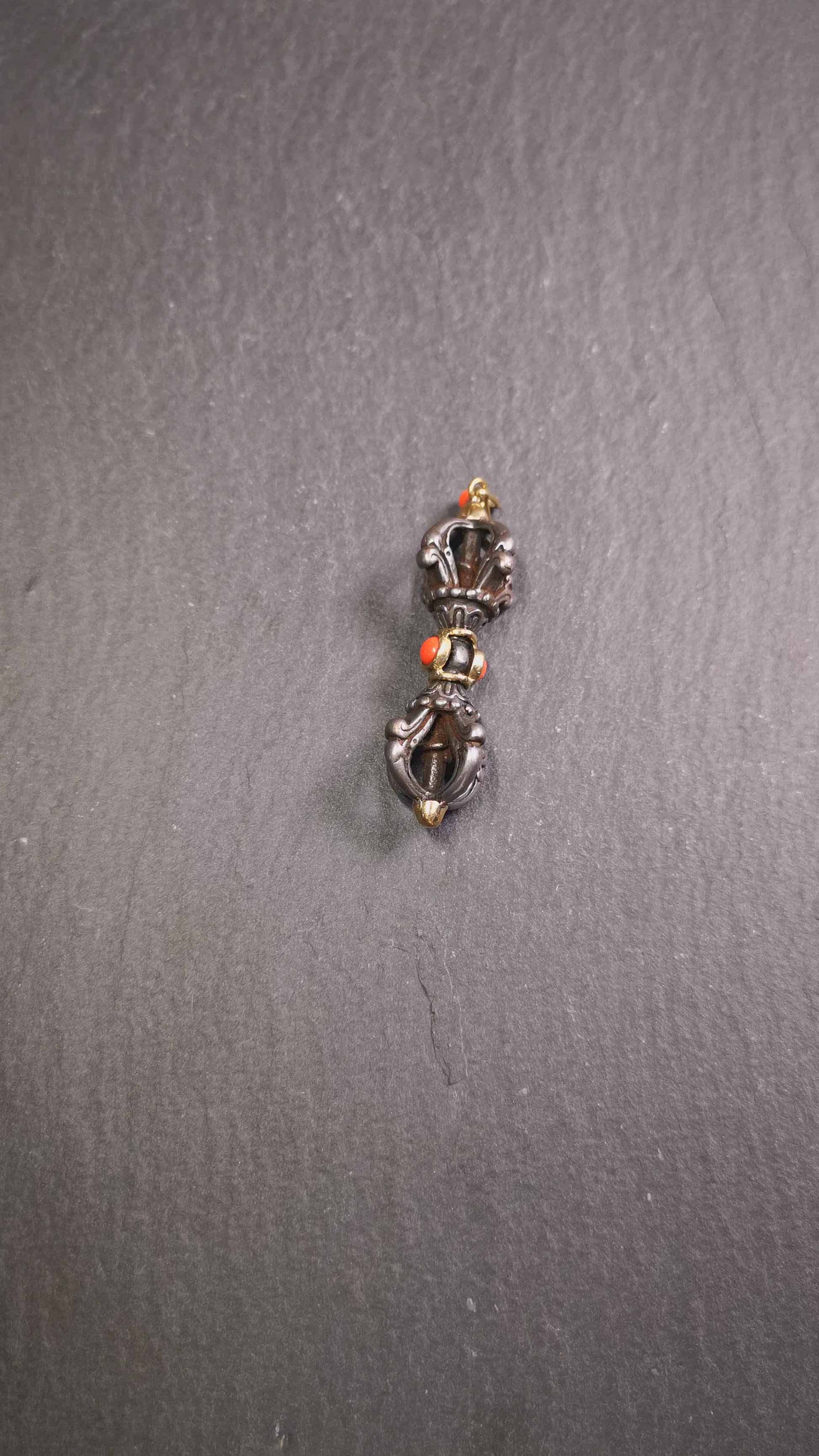 This unique vajra pendant was handmade by Tibetan craftsmen from Tibet in 1990's,from Hepo Town, Baiyu County, the birthplace of the famous Tibetan handicrafts. It is five-pronged Vajra,made of cold iron, 1.77 inch height.Comes with leather cord. You can make it a necklace, pendant, keychain, mala pendant, or just as an ornament on your desk.