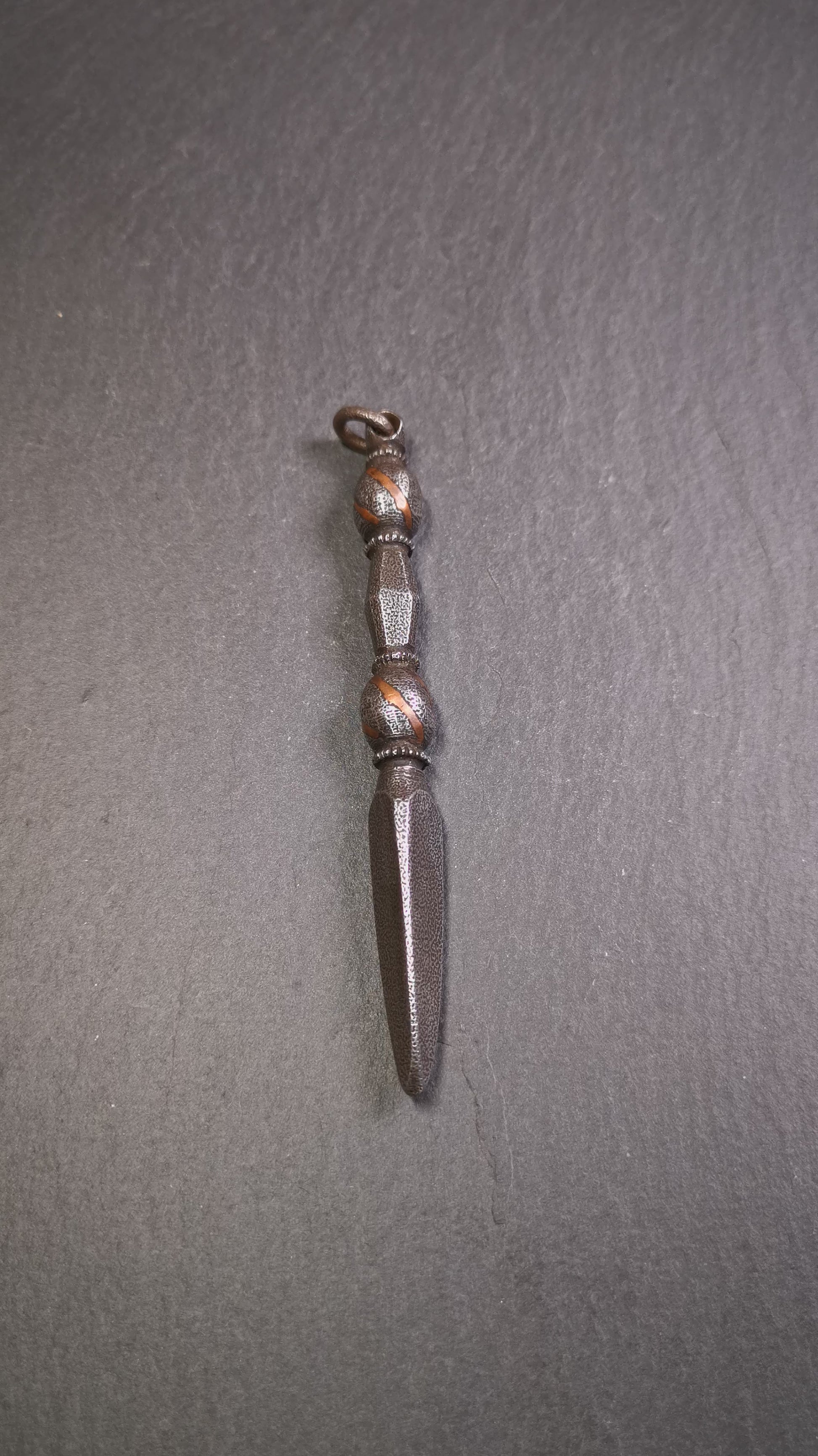 This handmade Dorje Phurba was crafted by Tibetan craftsmen from Hepo Town, Baiyu County, Tibet,known for its renowned Tibetan handicrafts. The upper part is a vajra, and the lower part is a phurba. A copper wire is inlaid on the waist of the phurba