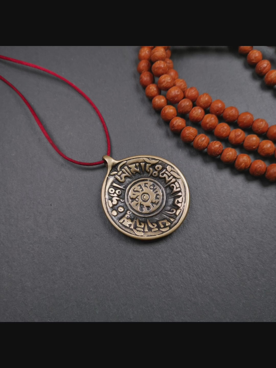 This Om badge amulet was collected from Yushu City Tibet,about 50 years old. It is round shape,made of lima brass, 1.58 inches,carved with mantra of chenrezig OM MANI PADME HUM. You can make it into a necklace, or a keychain, pendant