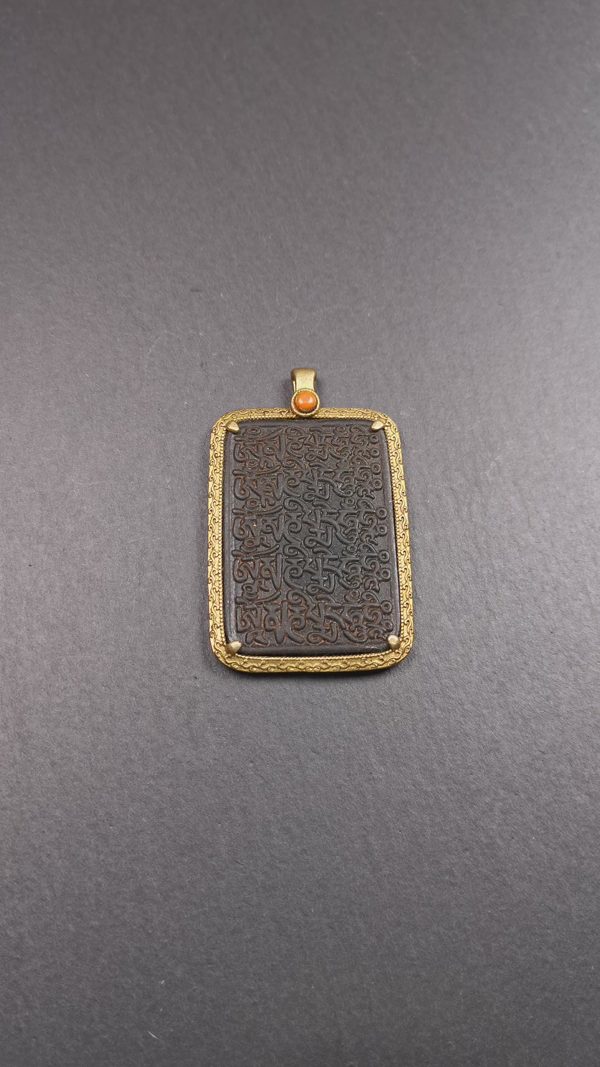 This badge is made by Tibetan craftsmen from Hepo Town, Baiyu County, the birthplace of the famous Tibetan handicrafts. It is made of copper, 2.52 × 1.57 inches. The front is the OM mantra and the back is body, speech, and mind.