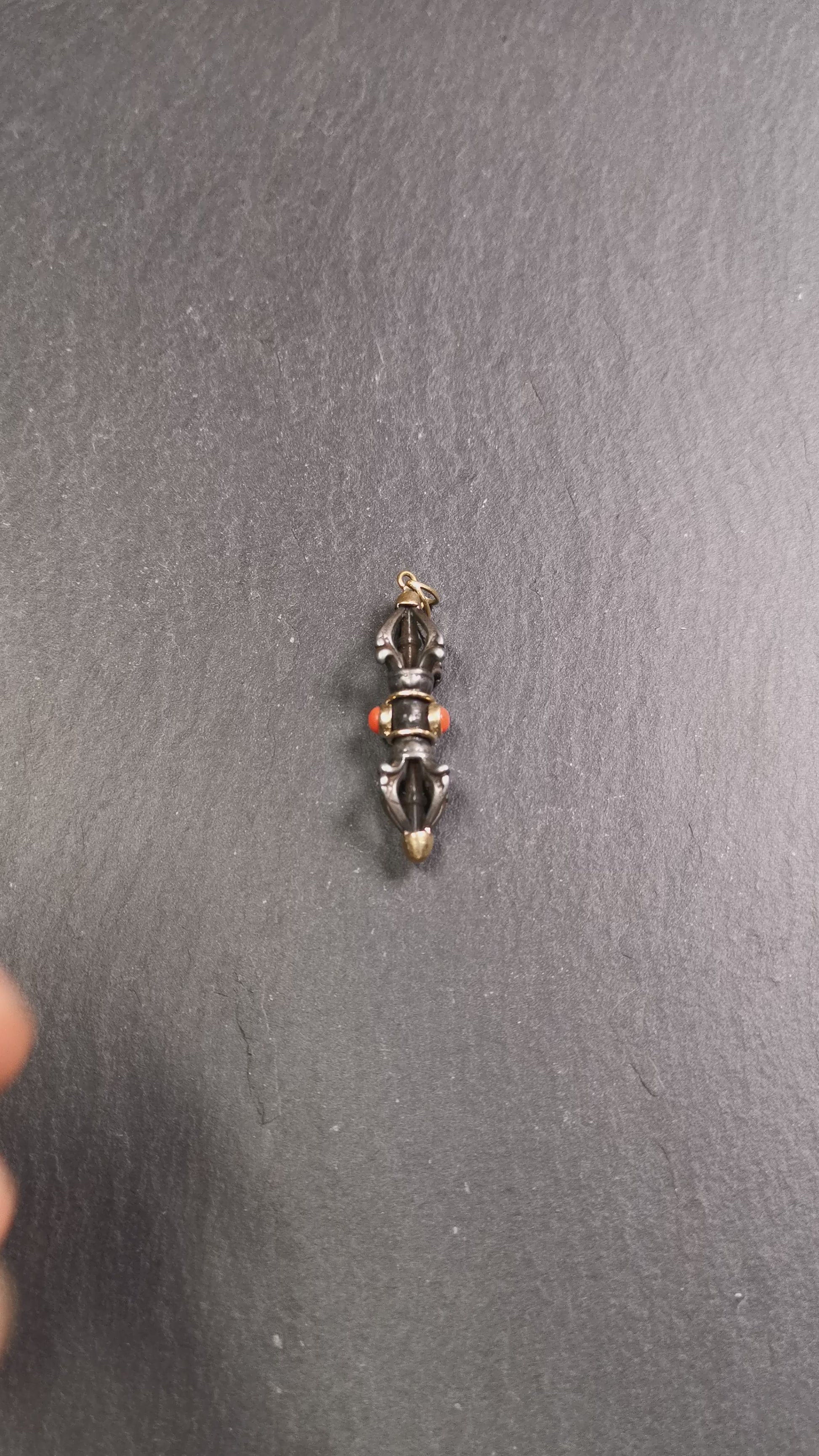 This unique vajra pendant was handmade by Tibetan craftsmen from Tibet in 1990's,from Hepo Town, Baiyu County, the birthplace of the famous Tibetan handicrafts. It is five-pronged Vajra,made of cold iron, 1.77 inch height.Comes with leather cord. You can make it a necklace, pendant, keychain, mala pendant, or just as an ornament on your desk.