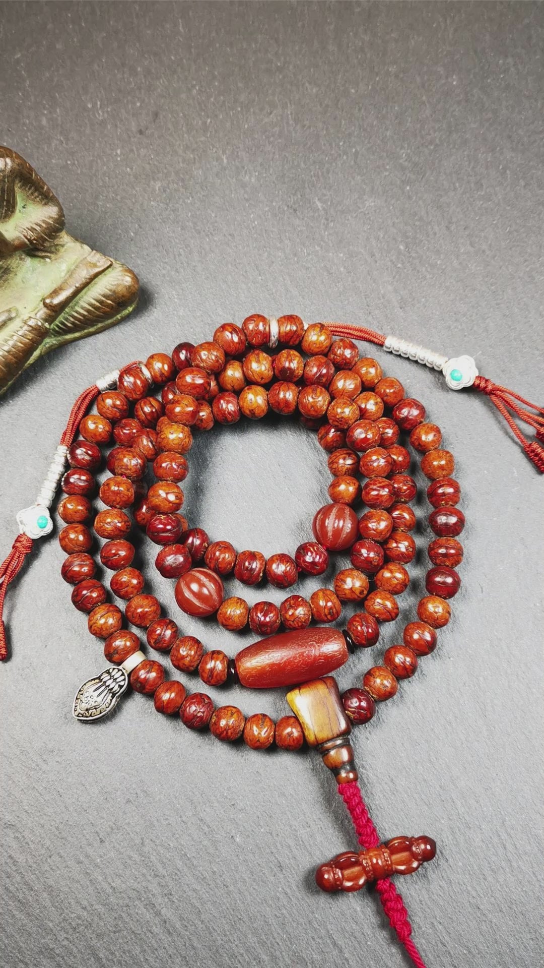 This bodhi beads mala is made by Tibetan craftsmen and come from Hepo Town, Baiyu County, the birthplace of the famous Tibetan handicrafts,about 30 years old, hold and blessed by a lama in Baiyu Monastery. It is composed of 108 bodhi seed beads, and is equipped with 3 agate beads, silver bead counters are installed on both sides, 1 mani jewel bead clip,and finally consists a bone guru bead and vajra on the end, very elegant.