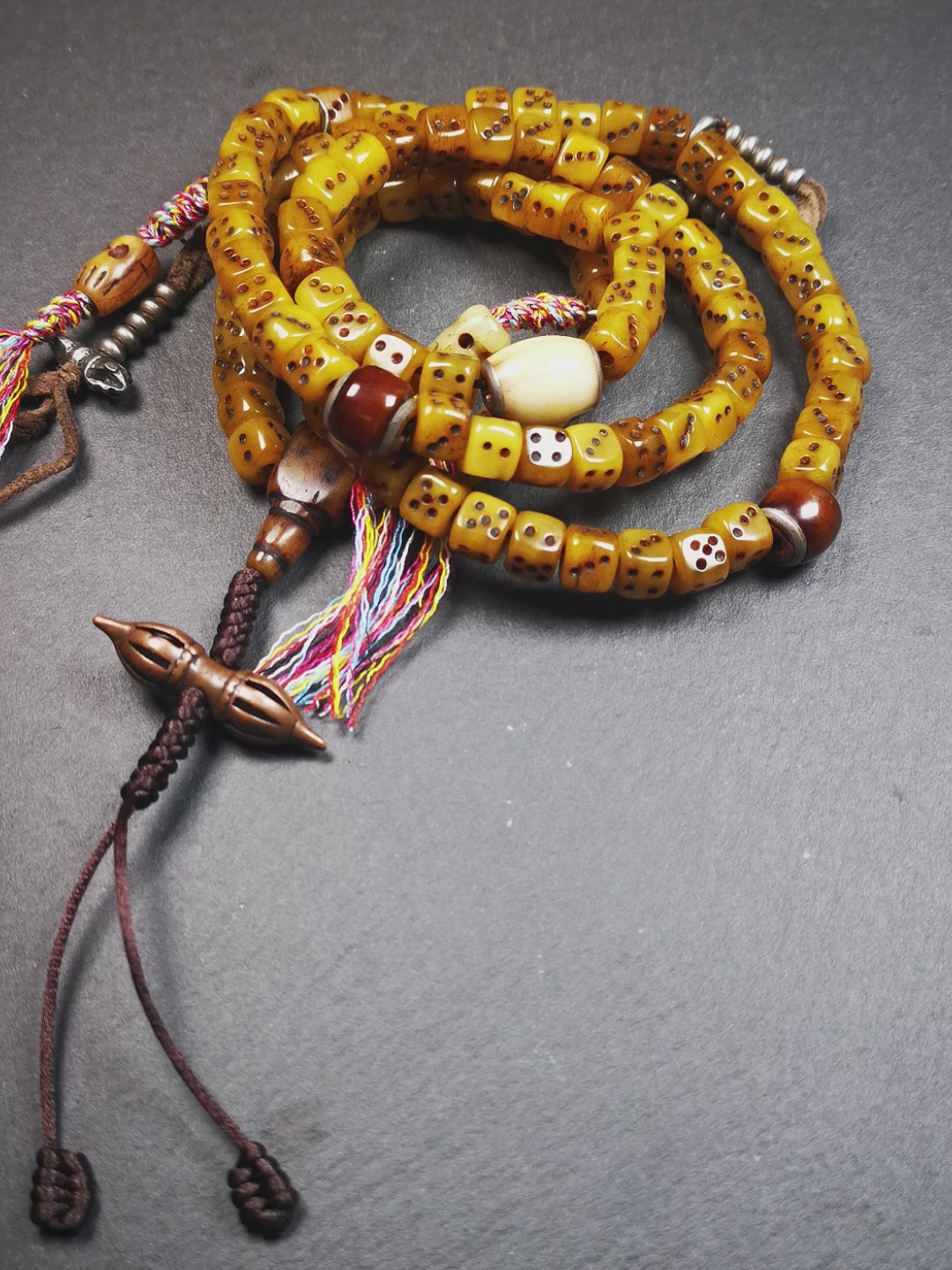 This unique mala was made by Tibetan craftsmen,blessed by lama. It is made of yak bone, yellow color,108 dice beads diameter of 8mm / 0.32",circumference is 84cm / 33",and lots of accessories on mala.